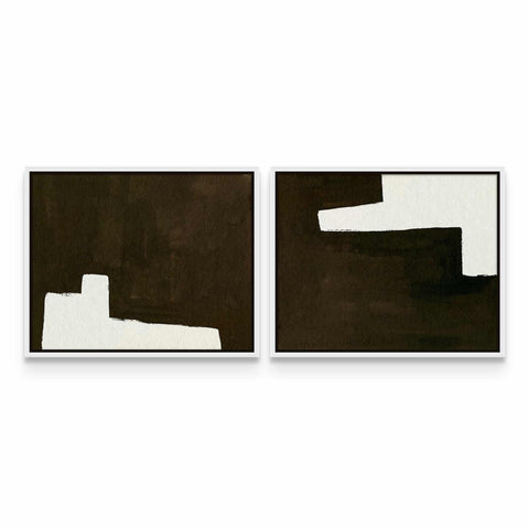 two black and white paintings on a white wall