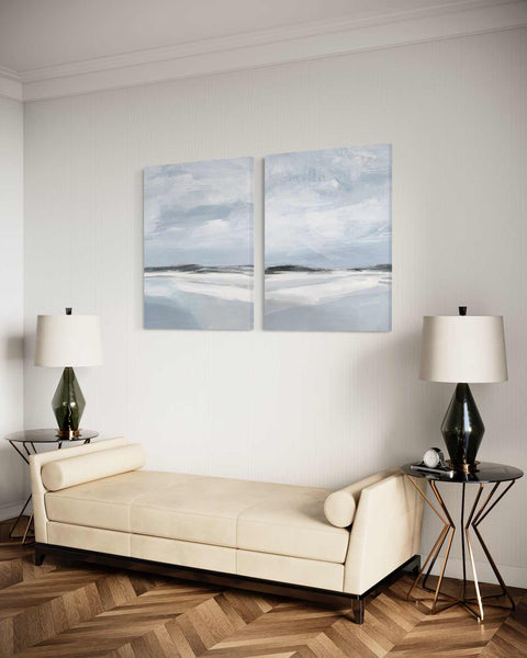 a living room with two paintings on the wall