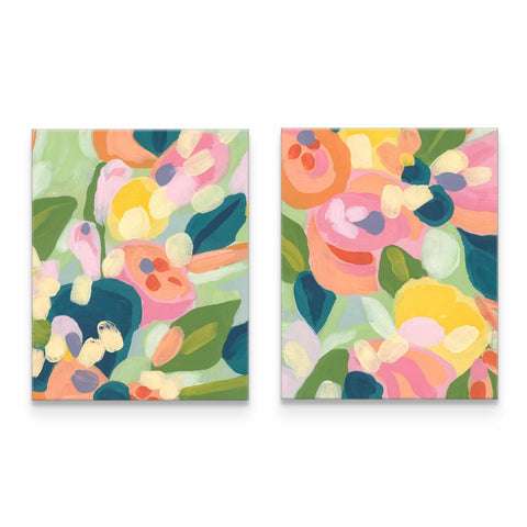 two paintings of flowers on a white wall