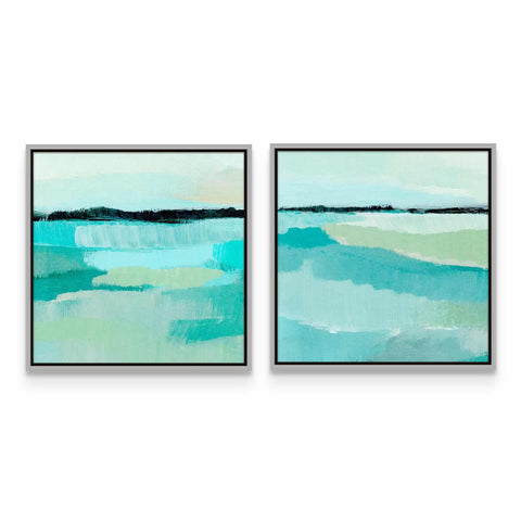 a couple of paintings hanging on a wall