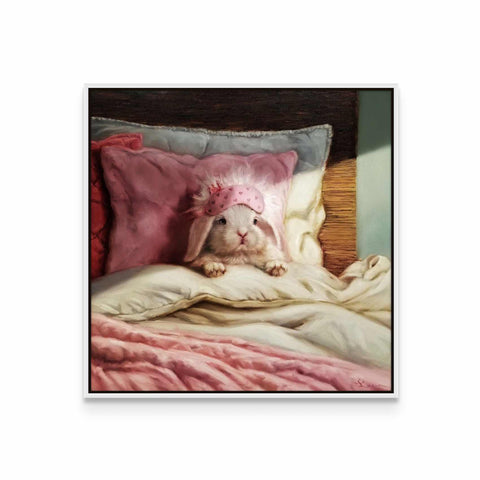 a dog laying on a bed with a pink blanket