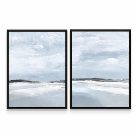 two framed paintings of a beach and sky