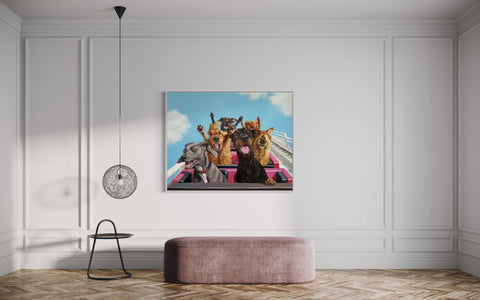 a group of dogs sitting on top of a pink bench