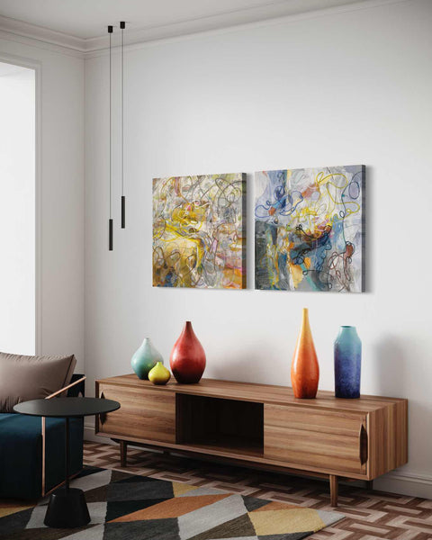 a living room with two paintings on the wall