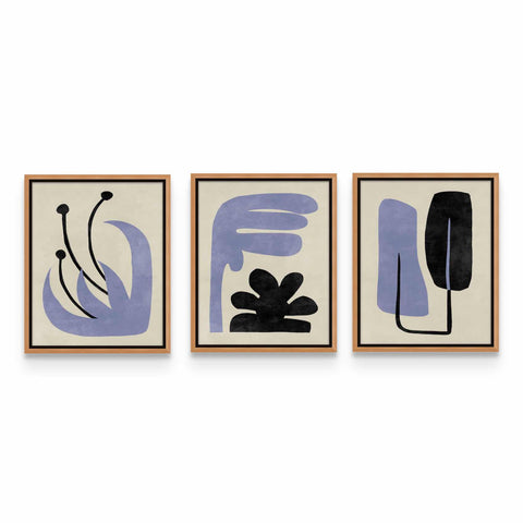 three abstract paintings hanging on a wall