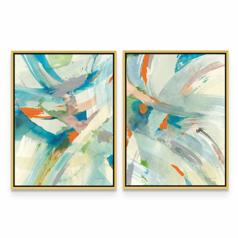 two abstract paintings in a gold frame on a white wall