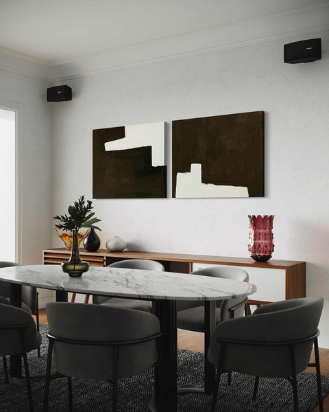 a dining room with a marble table and chairs