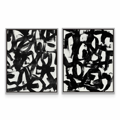 two black and white paintings on a white wall