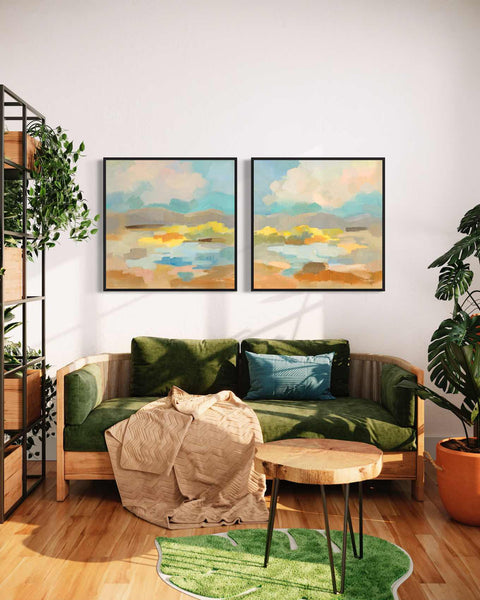 a living room with two paintings on the wall