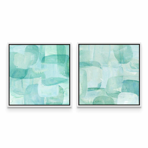 two paintings of blue and green shapes on a white wall