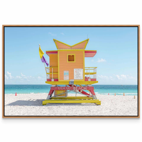 a lifeguard's tower on a beach with the ocean in the background