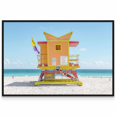 a lifeguard's tower on a beach with the ocean in the background