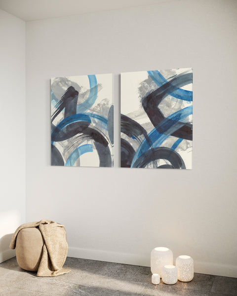 a couple of paintings hanging on a wall