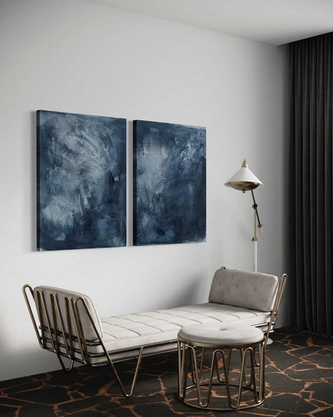 a living room with two paintings on the wall