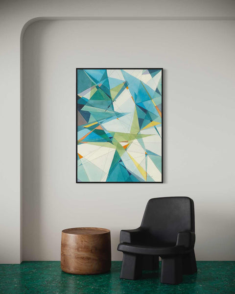 a painting hanging on a wall next to a chair