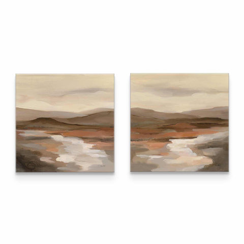 two paintings of a desert landscape on a white wall