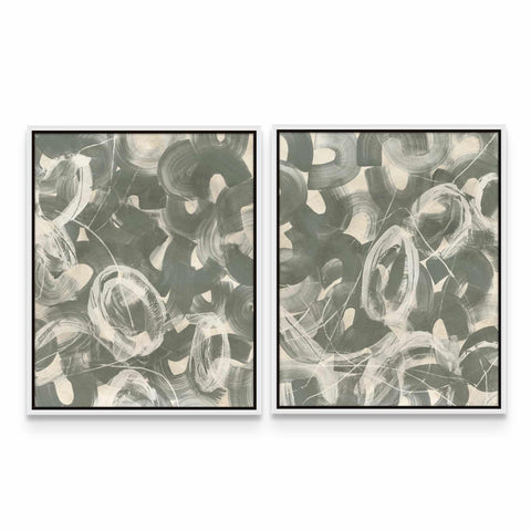 two paintings of black and white circles on a white wall