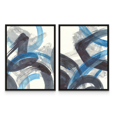 two framed paintings of blue and black circles