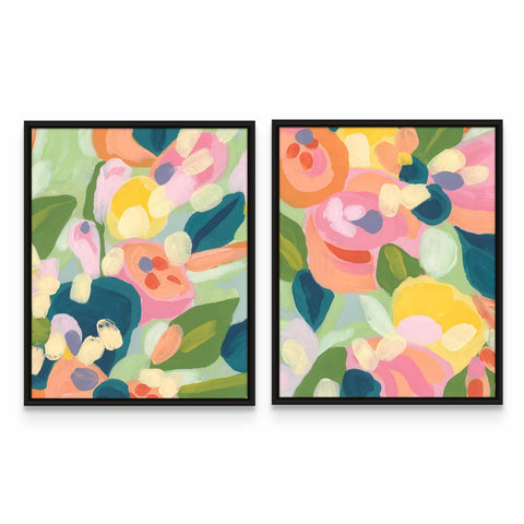 two framed paintings of flowers on a wall