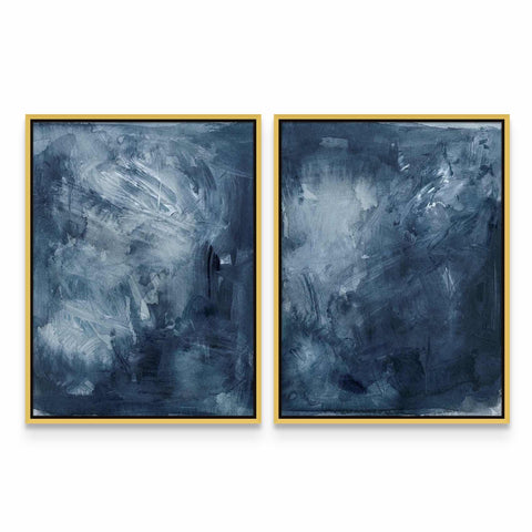 two paintings of blue and white with gold frames