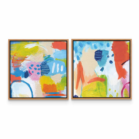 two abstract paintings hanging on a wall