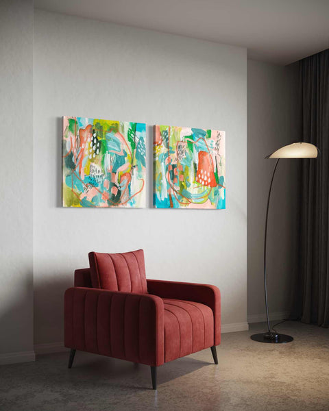 a living room with two paintings on the wall