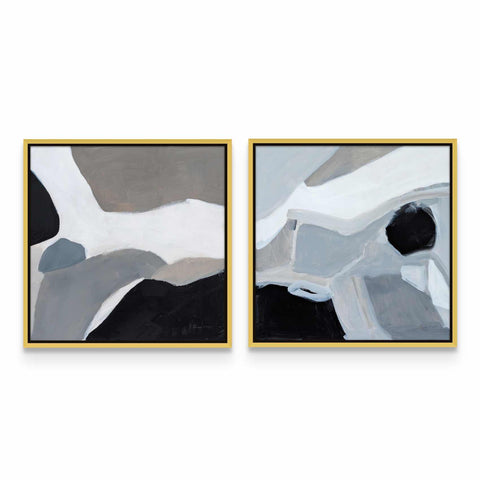 two paintings of black, white and grey on a white wall