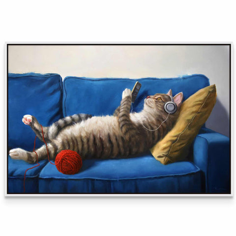 a cat laying on its back on a blue couch