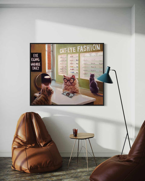 a cat sitting on top of a table next to a chair