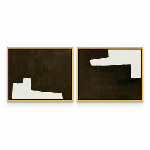 two black and white paintings on a white wall