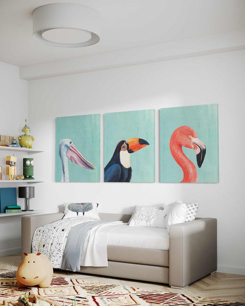 a living room with three paintings on the wall
