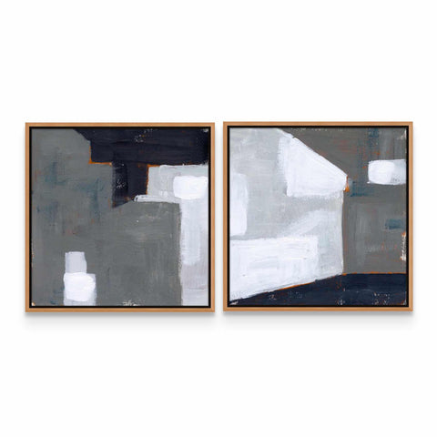 two paintings of white and black on a white wall