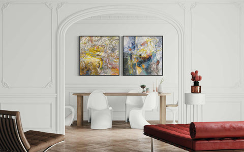 a living room with two paintings on the wall