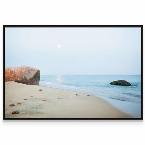 a picture of a beach with rocks and water