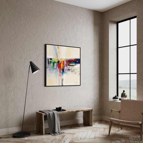 a living room with a large window and a painting on the wall