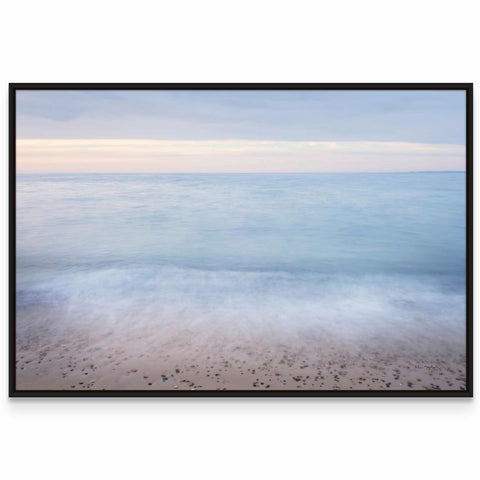 a picture of a beach with the ocean in the background