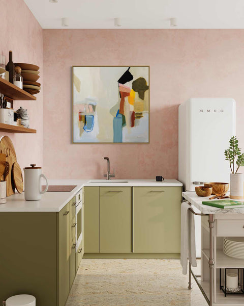 a kitchen with a painting on the wall