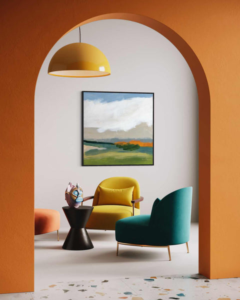 a living room with a painting on the wall