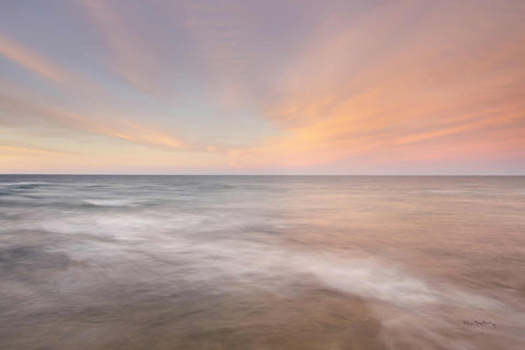 a long exposure photo of a sunset over the ocean
