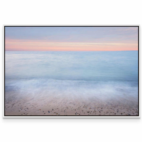 a picture of a beach with the ocean in the background