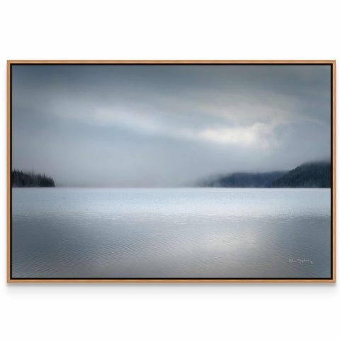 a picture of a large body of water under a cloudy sky