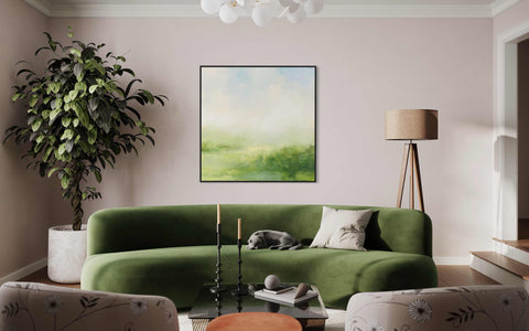 a living room filled with furniture and a painting on the wall