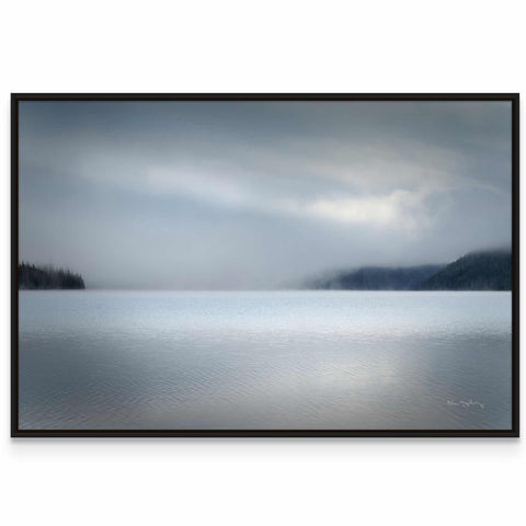 a picture of a large body of water under a cloudy sky