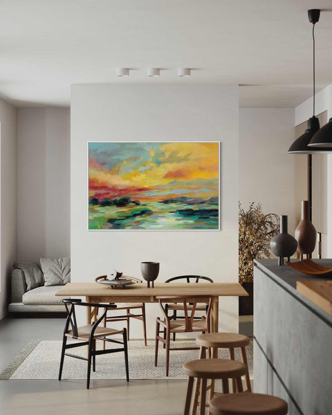 a painting hanging on a wall above a dining room table
