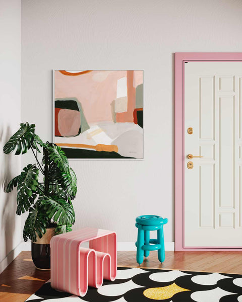 a living room with a potted plant and two stools