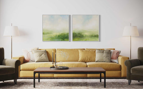 a living room with two paintings on the wall