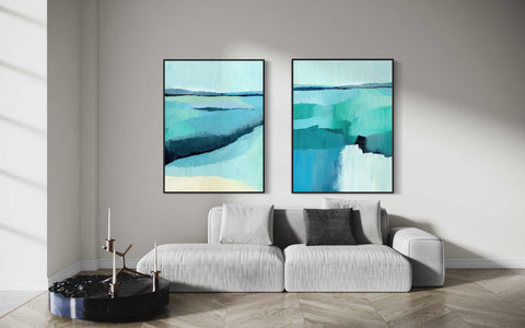 a living room with two paintings on the wall