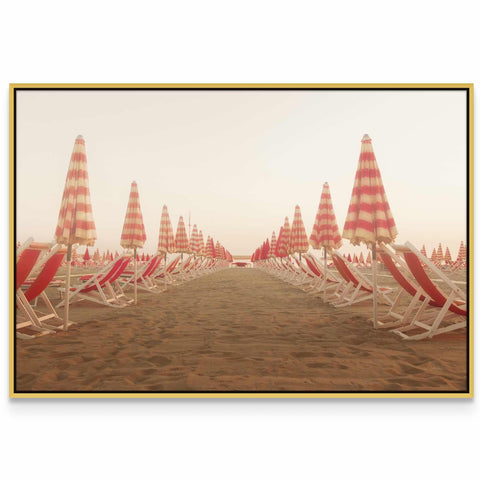 a row of beach chairs sitting on top of a sandy beach