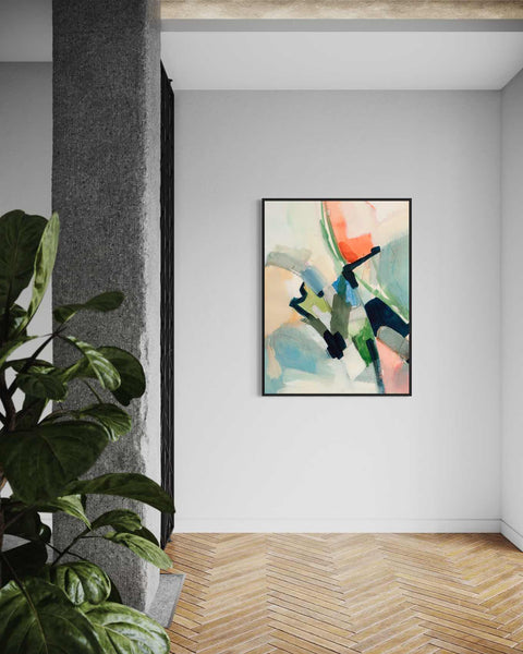 a painting hanging on a wall next to a plant
