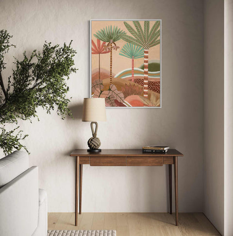 a living room with a table and a plant